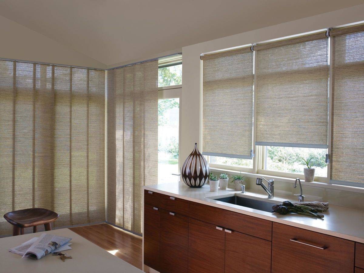 Hunter Douglas Designer Roller Shades accenting windows in a modern kitchen near Alpharetta, GA